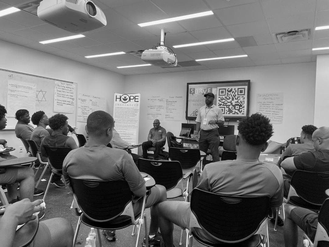 An I AM UNDERDOG mentorship session in a classroom